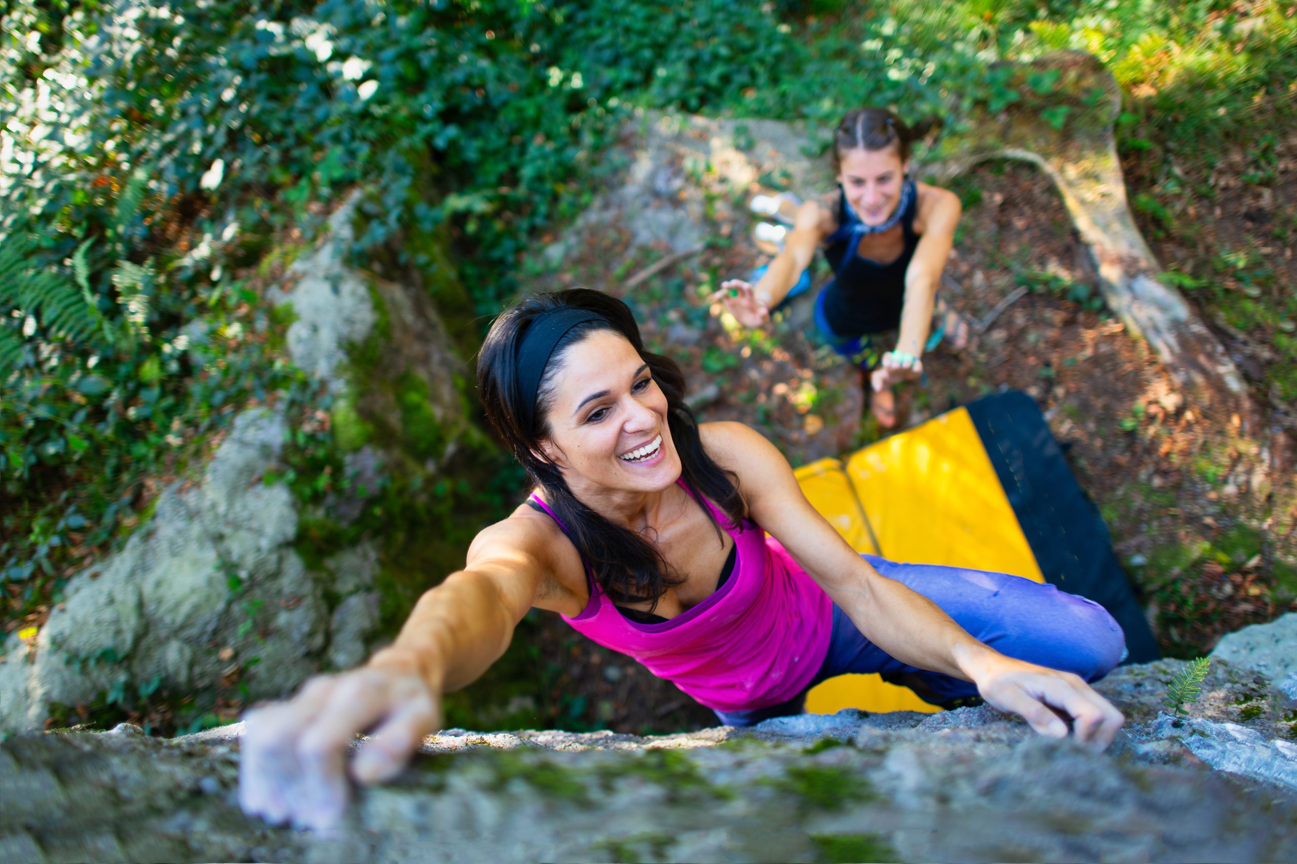 adventurer climbing a rock